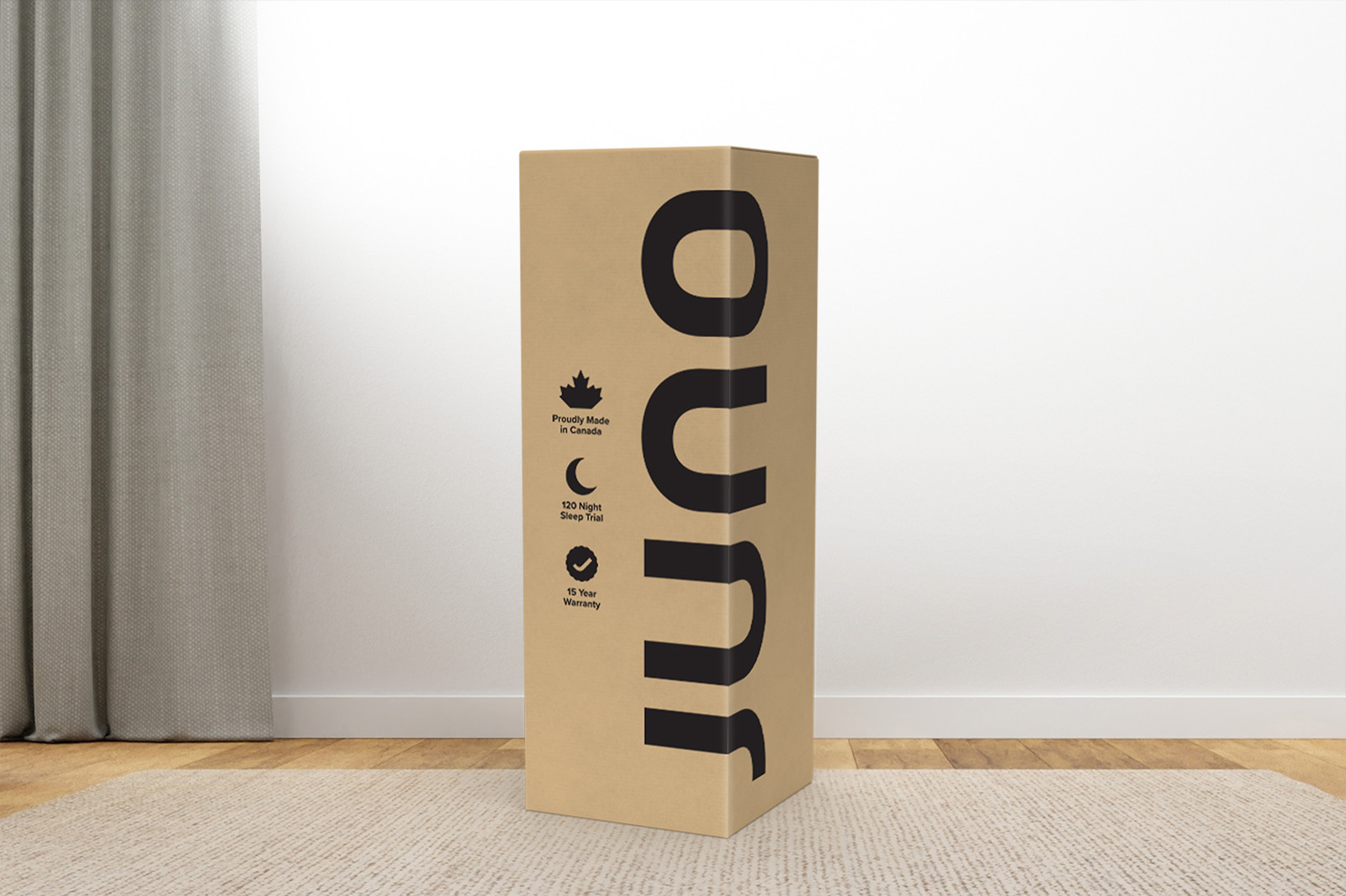 JunoBox MattressReviewscom Photo of a Juno mattress delivery box sitting on a carpet in a room