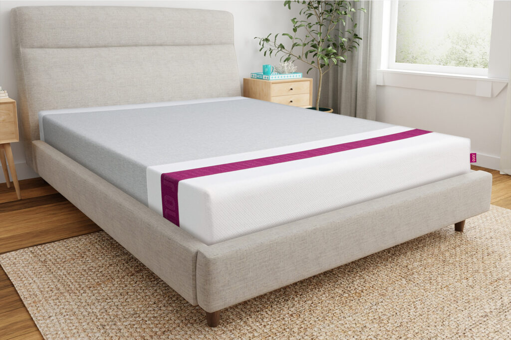 JunoCornerAngle MattressReviewscom Front corner angle photo of a Juno mattress sitting on a bedframe in a bedroom