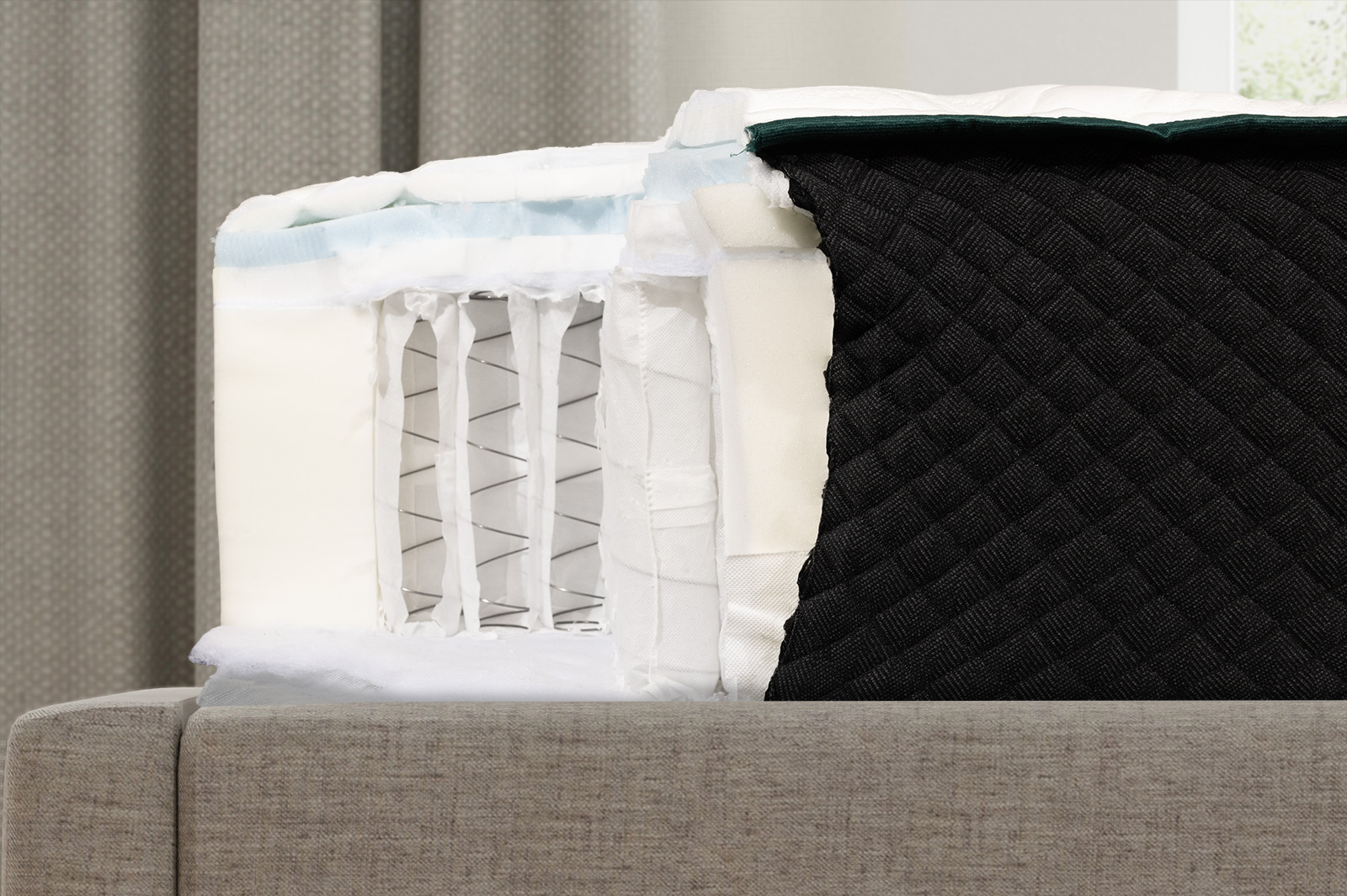 LCChoiceInternalsSide MattressReviewscom close up side view of the internal layers of the Logan Cove Choice mattress