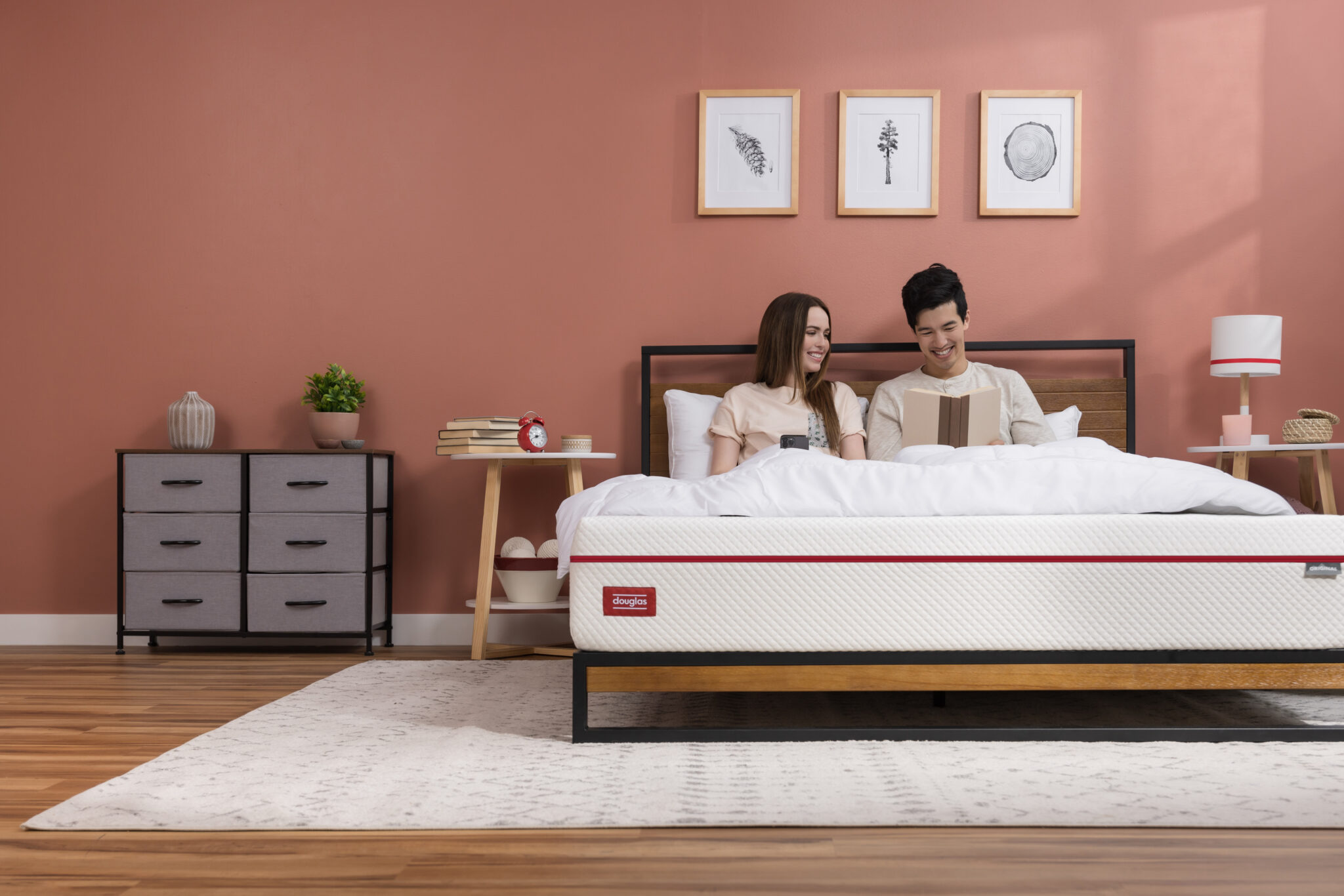 MattressSpace MattressReviewscom Image of two people on a Douglas mattress in a spacious bedroom